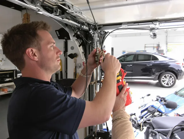 Baldwin Park Garage Door Repair safety certified technician performing cable replacement in Baldwin Park